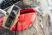 Washing a car with scrub brush