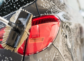Washing a car with scrub brush