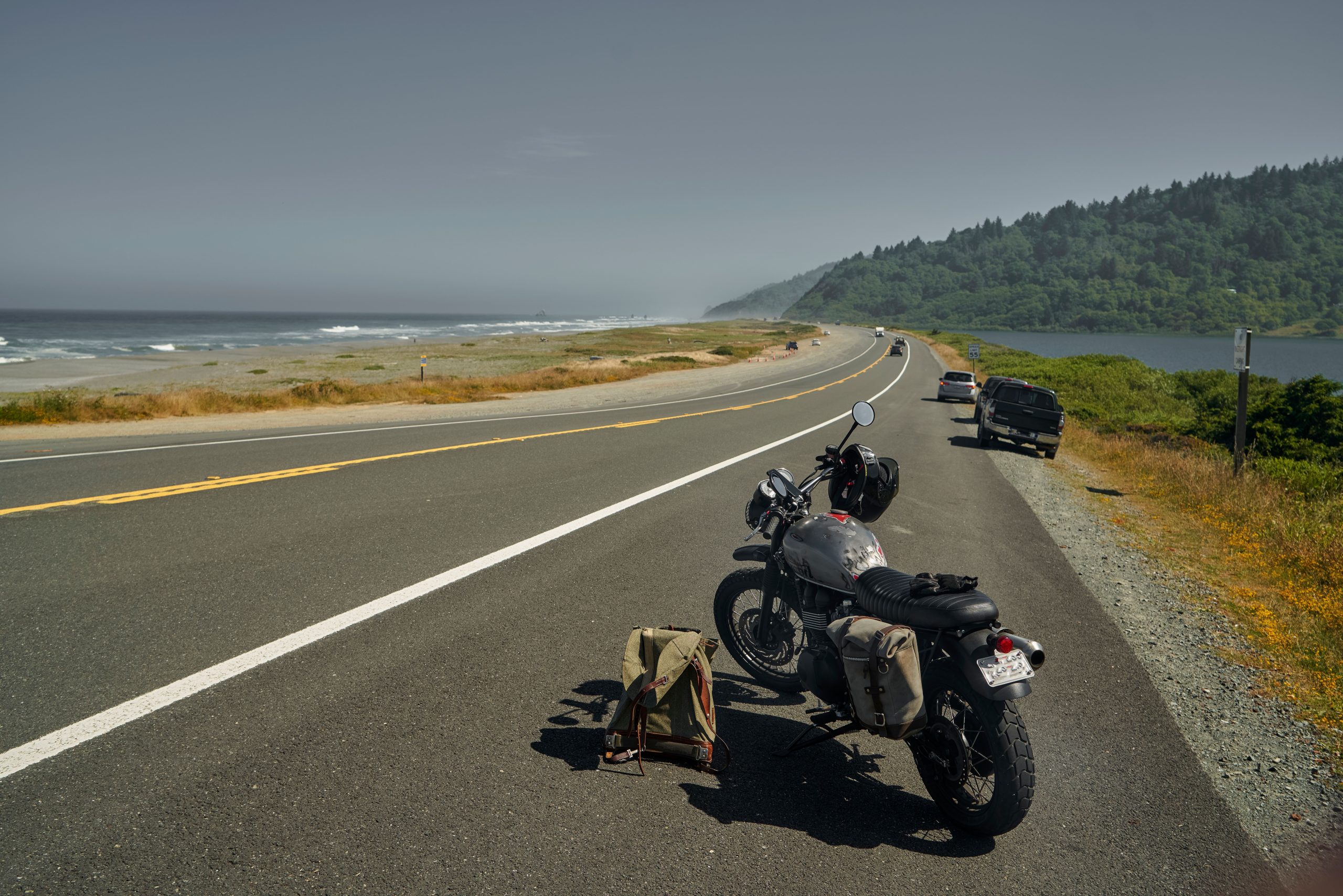 Motorcycle parked on a scenic coastal road overlooking the ocean, ideal for a Gulf Coast biker's ride